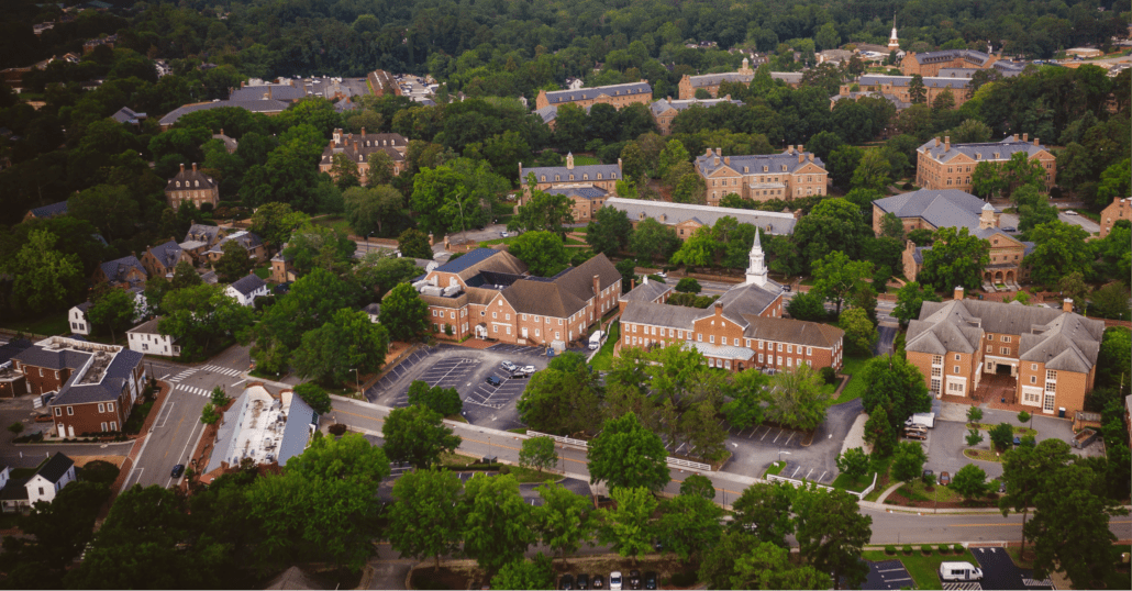 Aerial photography of Colonial Williamsburg showing historic buildings like the Governor's Palace, and the Palace Green.