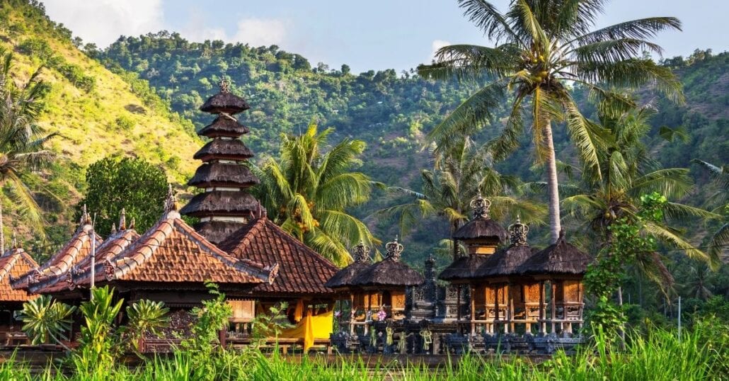 View of Balinese bungalows surrounded by the region's lush verdant forest.