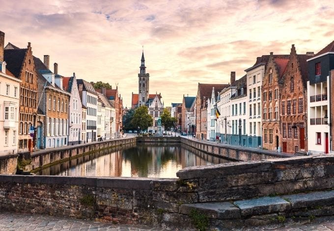 A canal lined with 17th-century houses in Bruges, belgium.