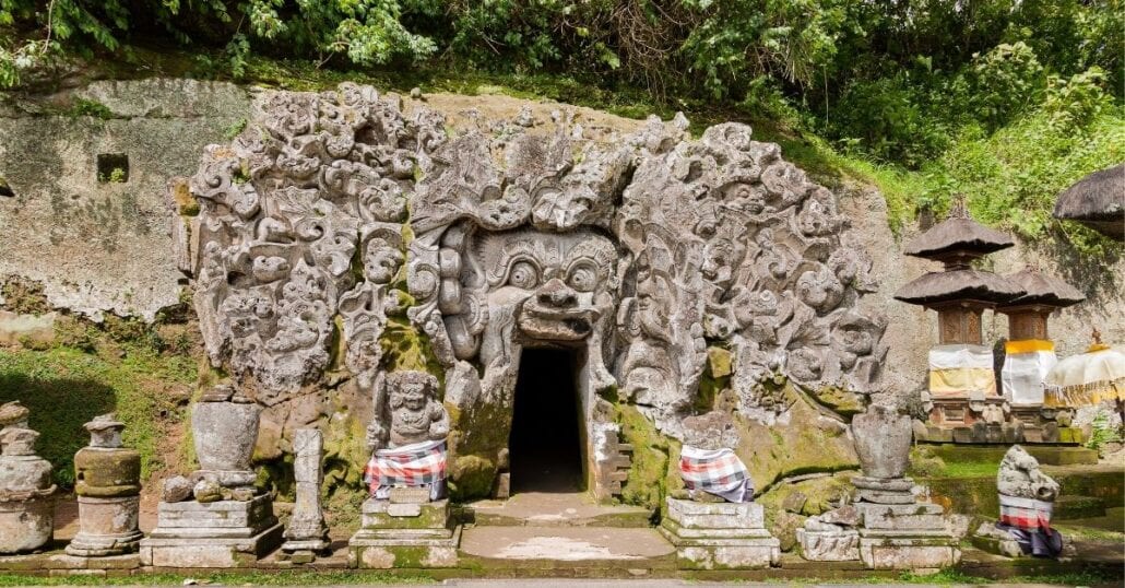 Entrance of the Goa Gajah, also known as "Elephant Cave", which is carved with creatures and geometric patternes.