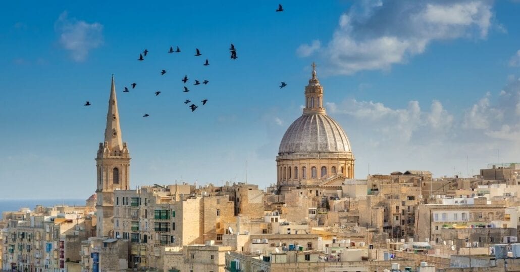 View of birds flying over Valletta, the capital of Malta, during a clear day.