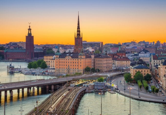 Aerial view of Stockholm's waterways and historical buildings at dusk.