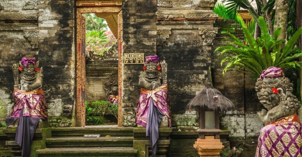 Sacred statues at the entrance of the Ubud Royal Palace, one of the top tourist attractions in Bali. 