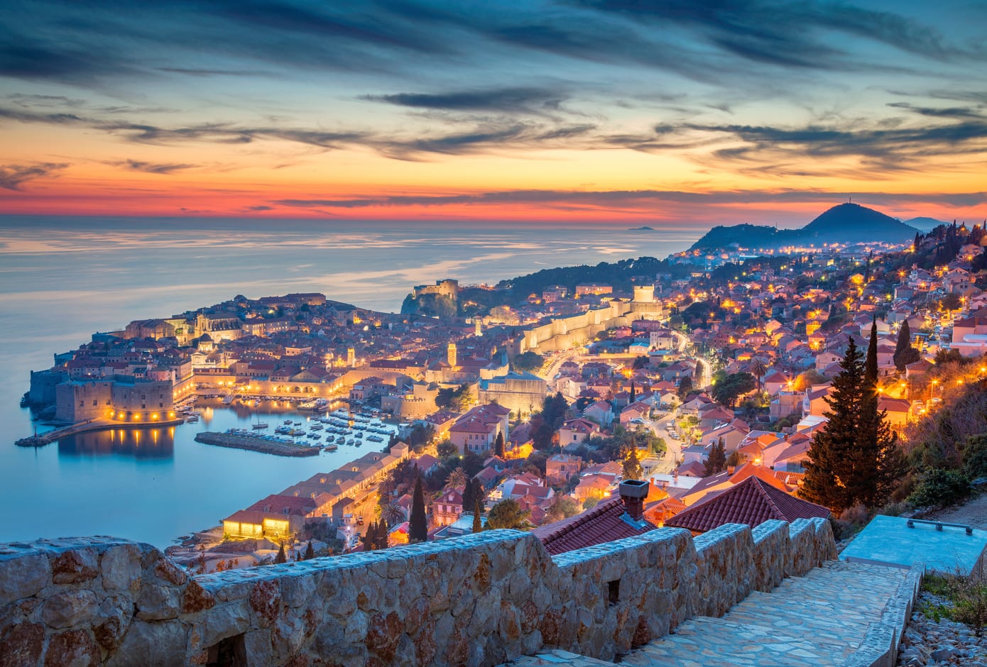 A yellow, blue, and pink sunset in Dubrovnik, Croatia.