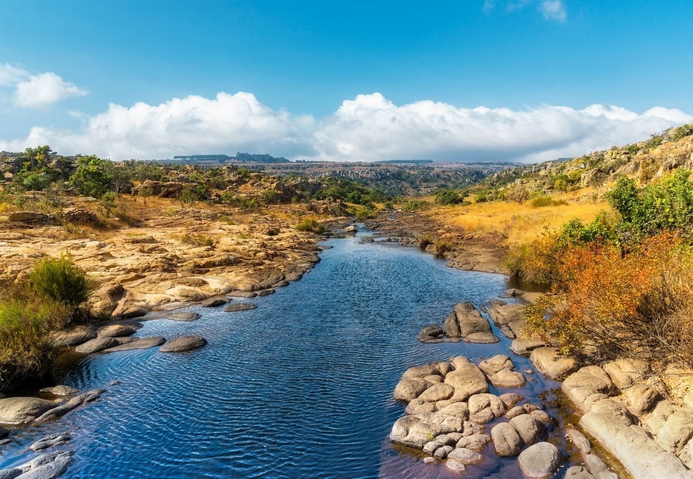 A small lagoon surrounded by rocks at the Panorama Route, in South Africa.