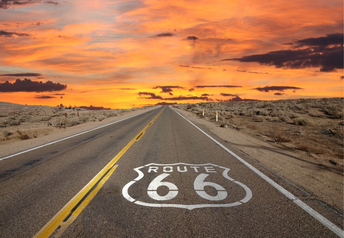 The route 66 during an orange sunset.