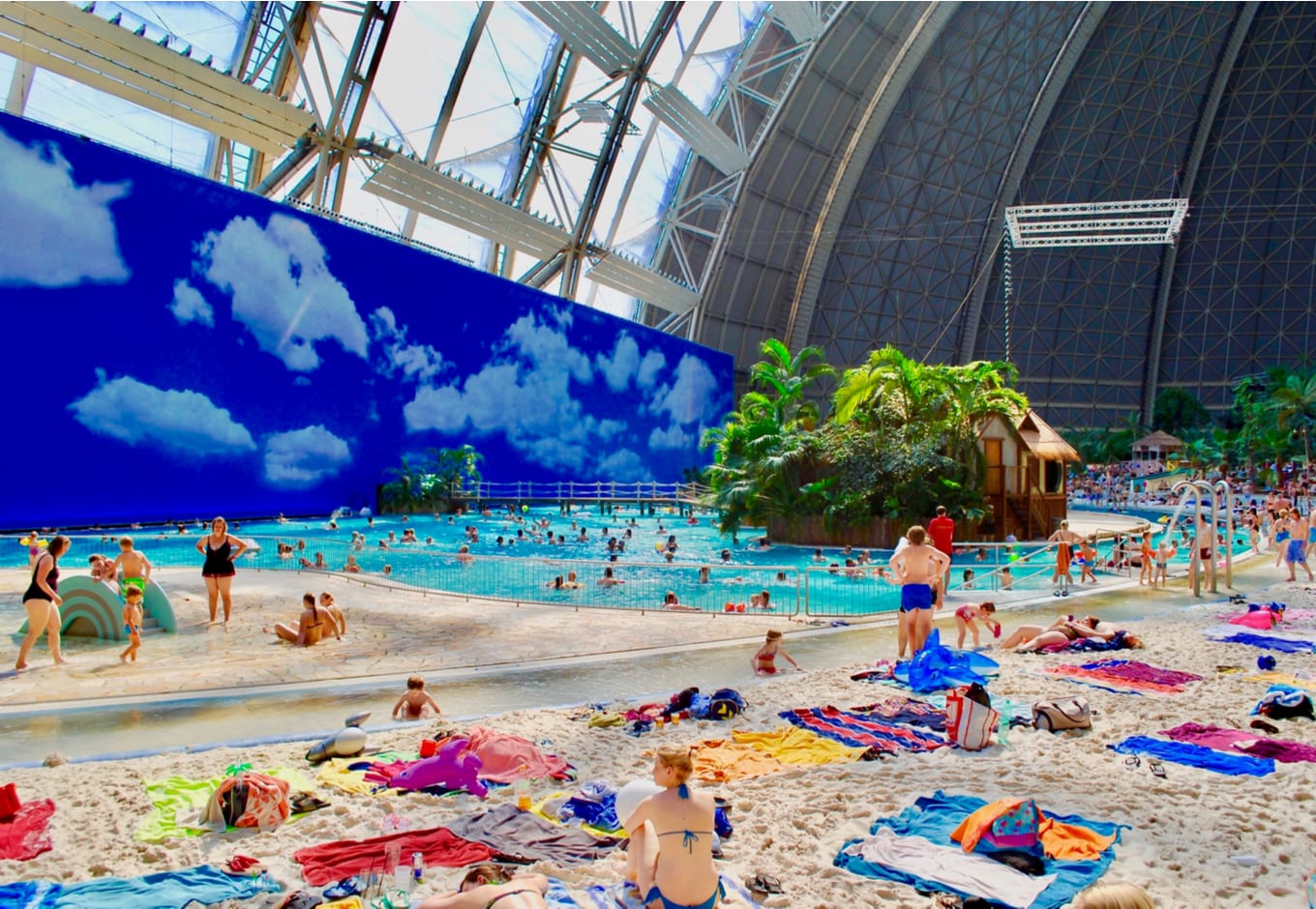 View the sandy beach by the pool at the Tropical Islands Water Park, in Germany.