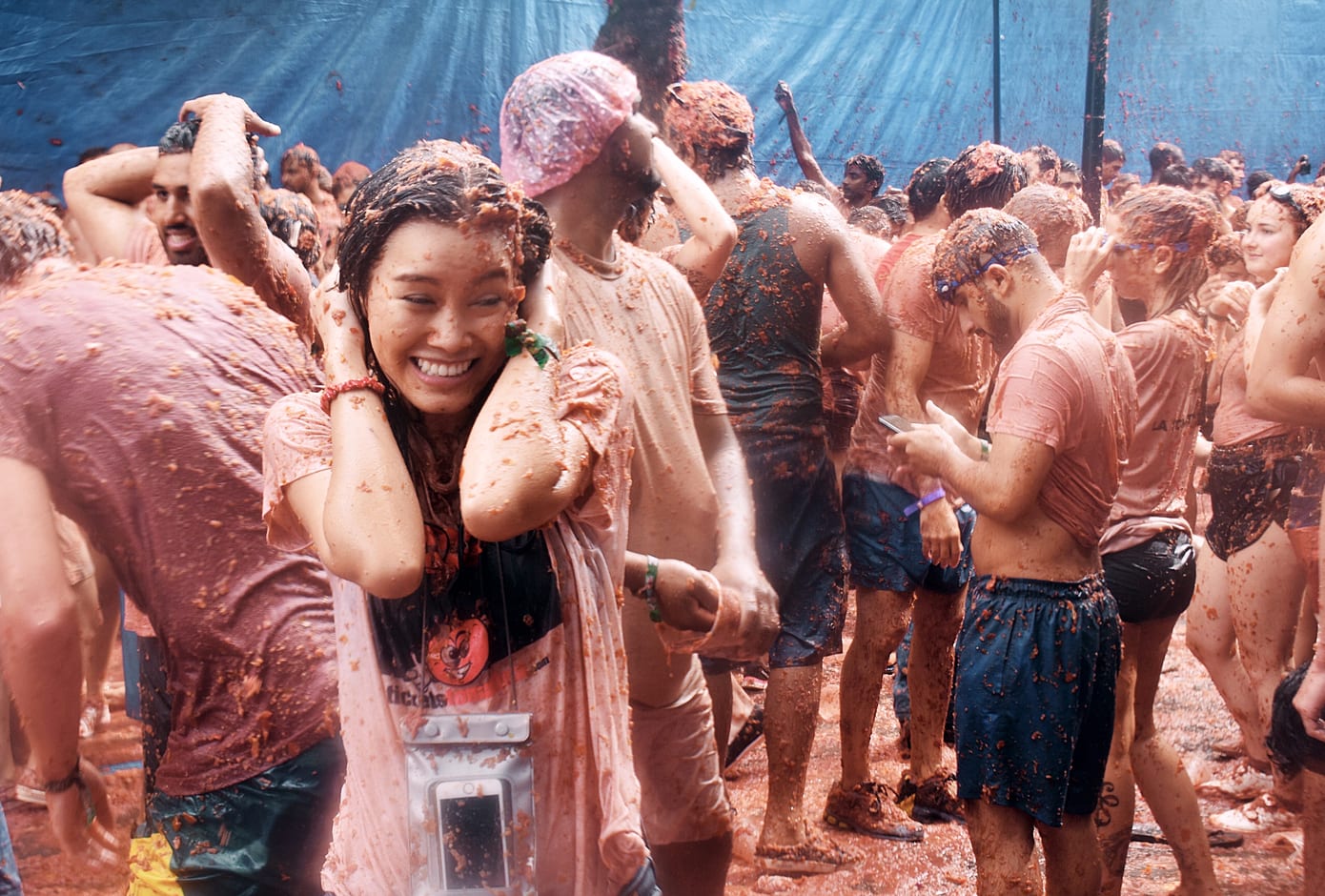 A woman covered in tomato juice during La Tomatina Festival, Bunol, Spain