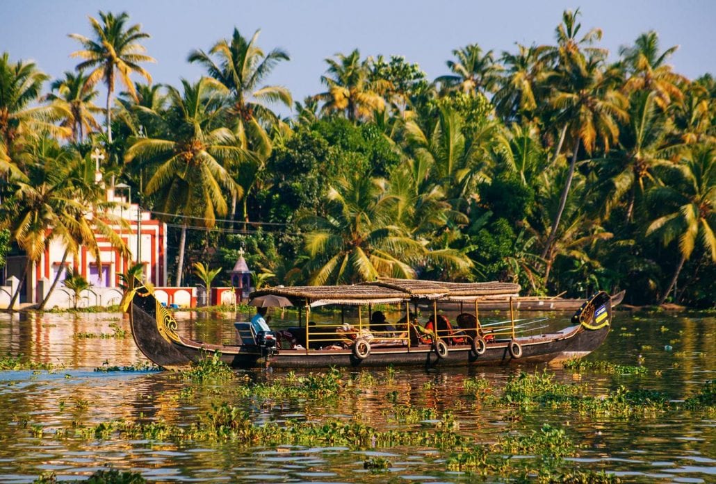 A house boat transports tourists around the backwaters in Alleppey, India.