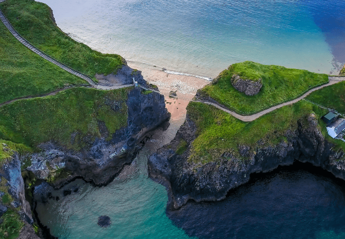 The rope bridge connecting the two cliffs in Northern Ireland it is called the Carrick-a-Rede Rope Bridge.