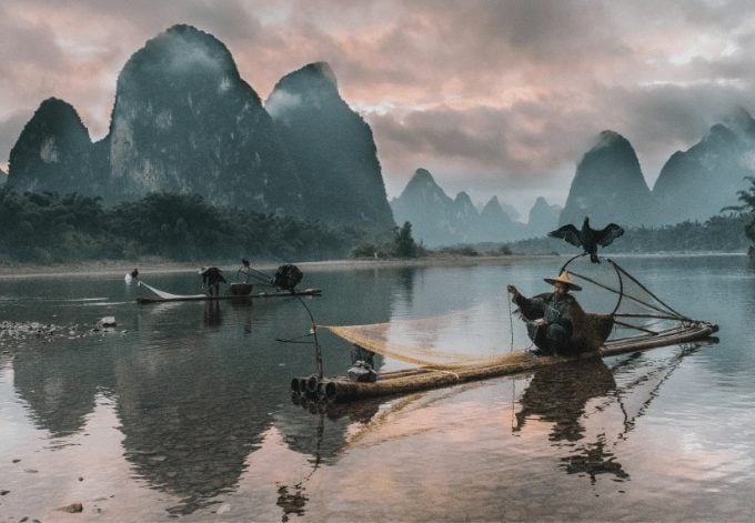 Two fishermen on the Li River, in China.