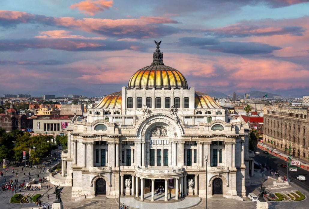 The façade of Palacio de Bellas Artes (Palace of Fine Arts), in Mexico City, at sunset.