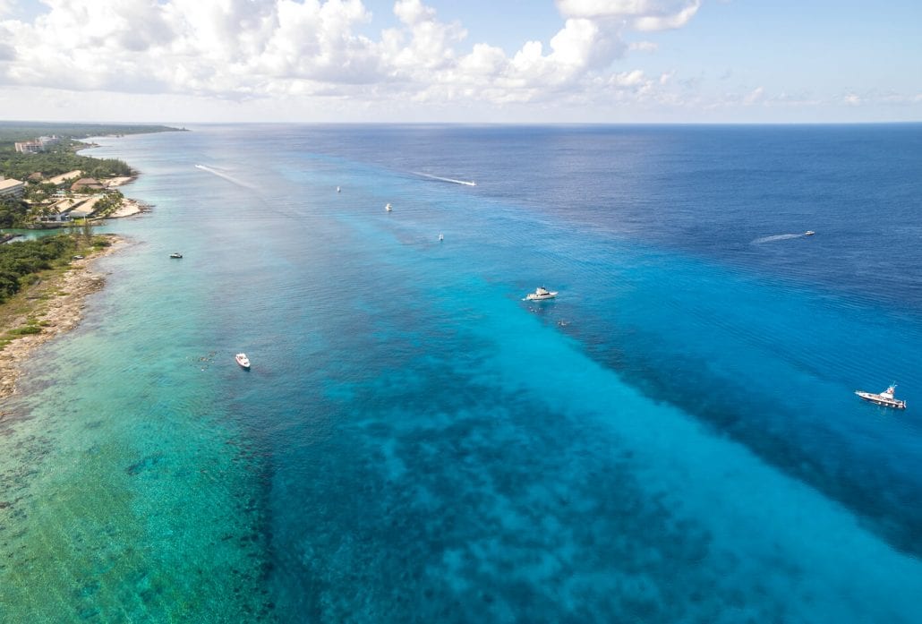Aerial view of boats on the water heading to Palancar Reef in Cozumel Mexico.