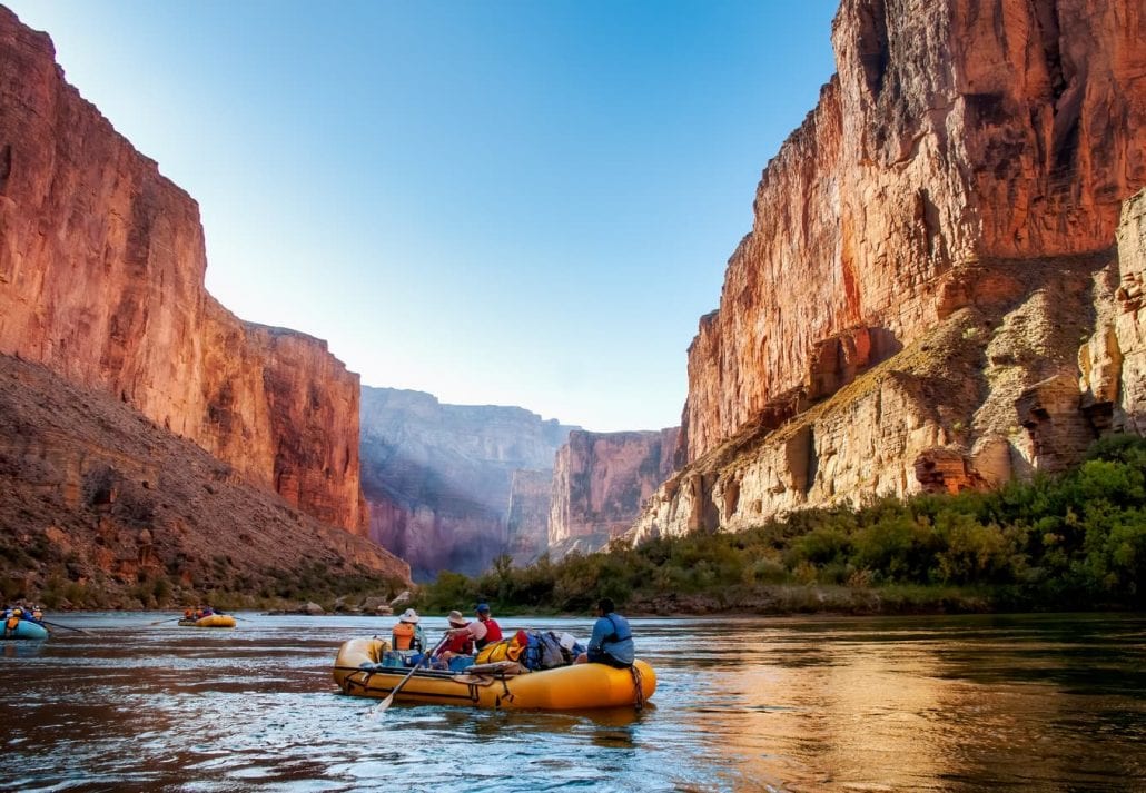 Rafting on The Colorado River in the Gran Canyon at sunrise.