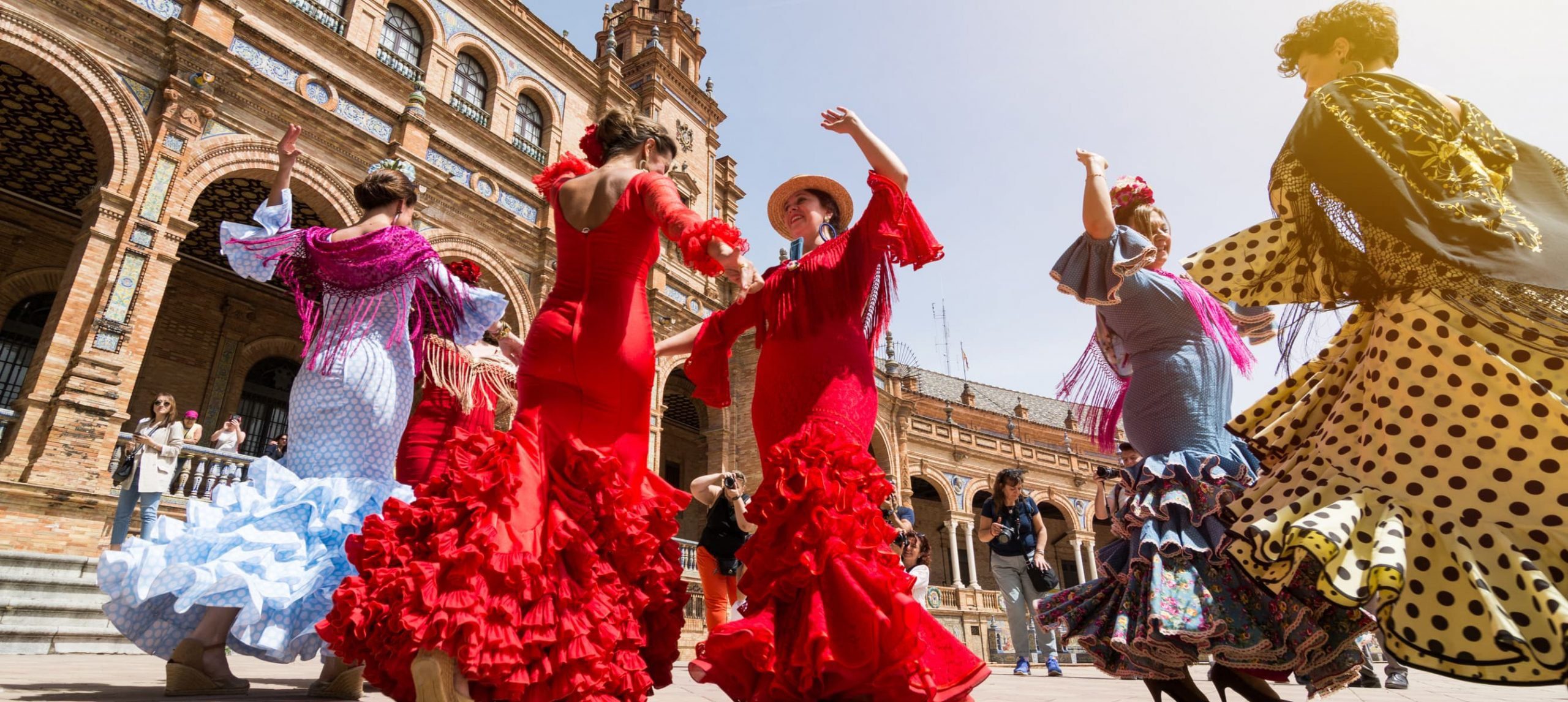Young women dance flamenco on Plaza de Espana
