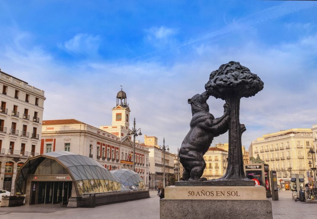 Madrid Spain city skyline at Puerta del Sol square with statue of the bear and the strawberry tree