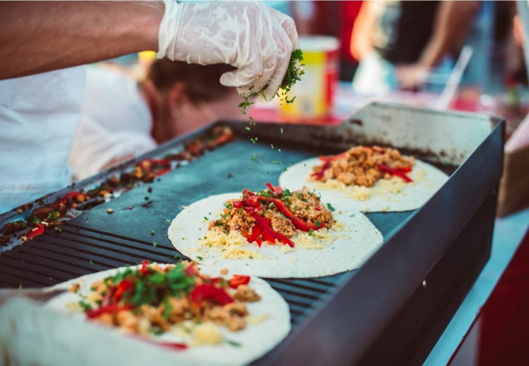 Mexican tortillas on the making at a street food stall.