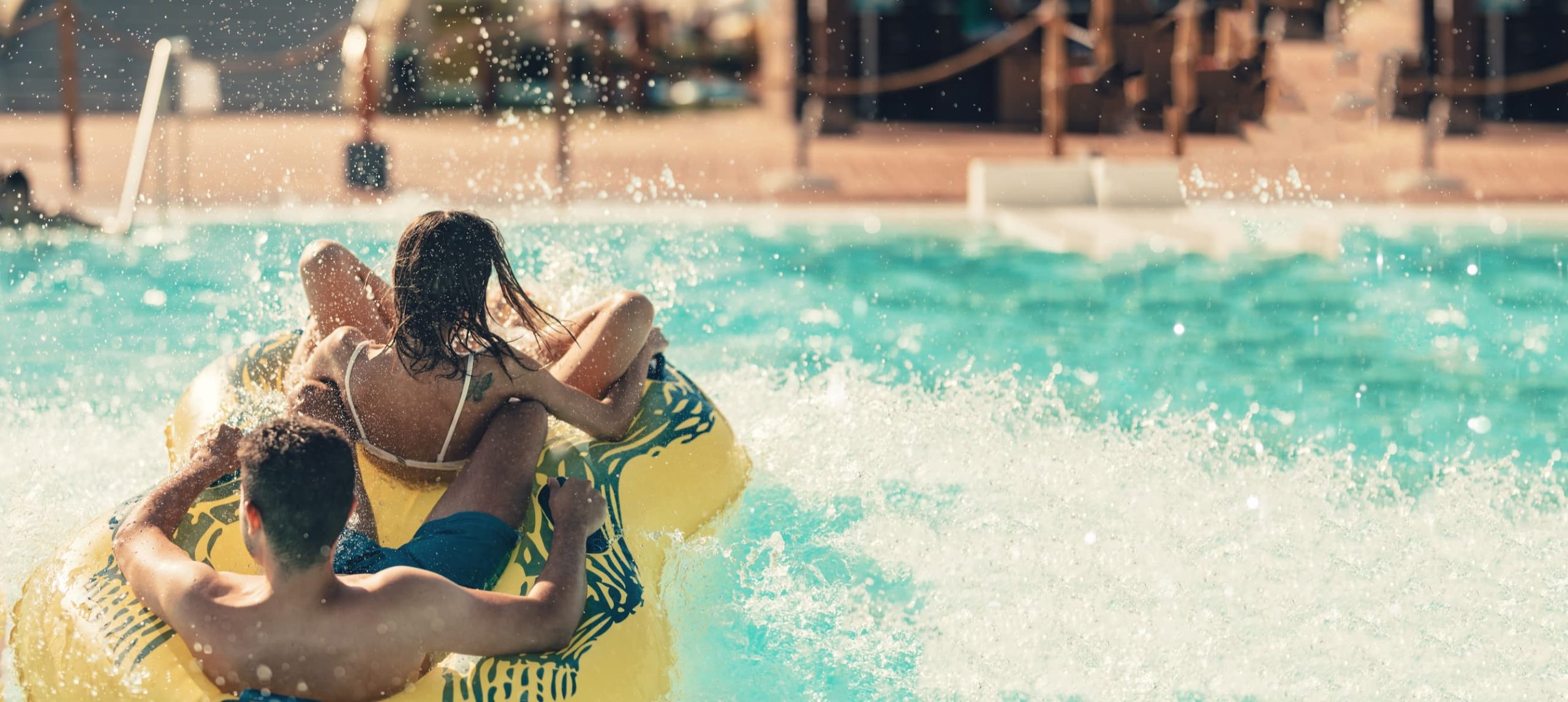 Two children having fun at a water park.