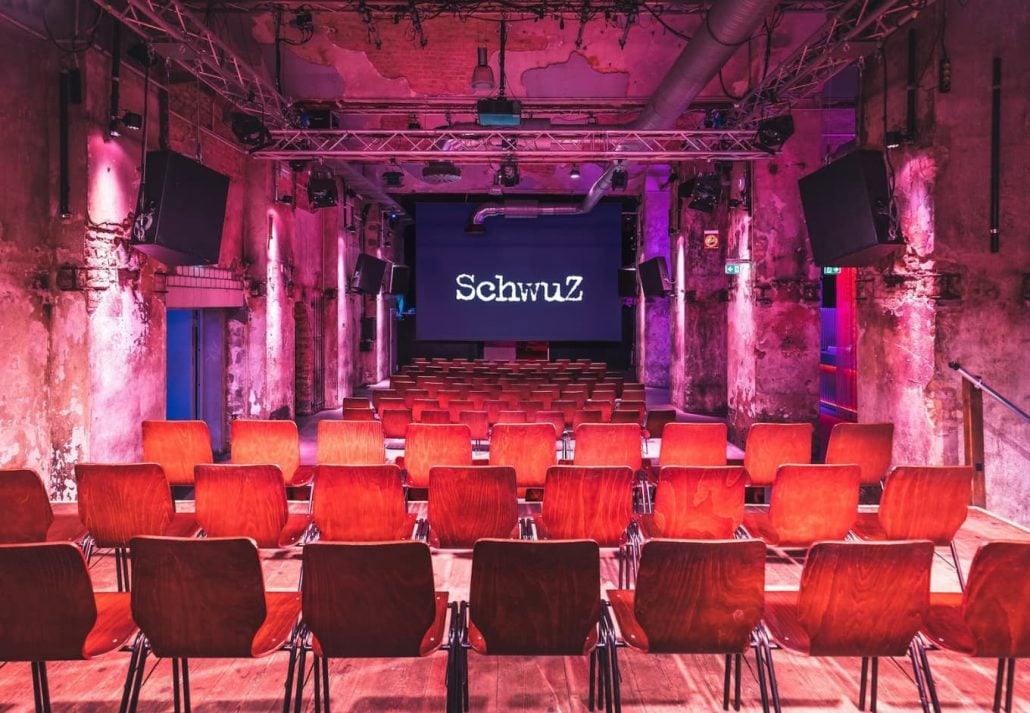 A speaking venue with chairs in front at Schwuz Berlin