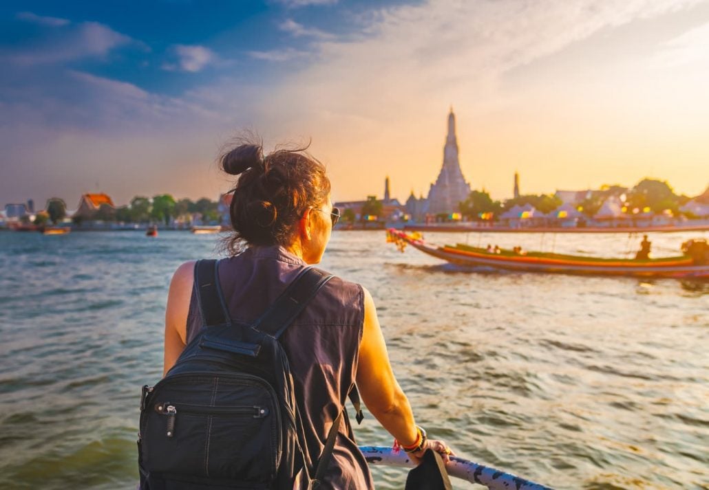 Young woman kayaking in Bangkok, Thailand