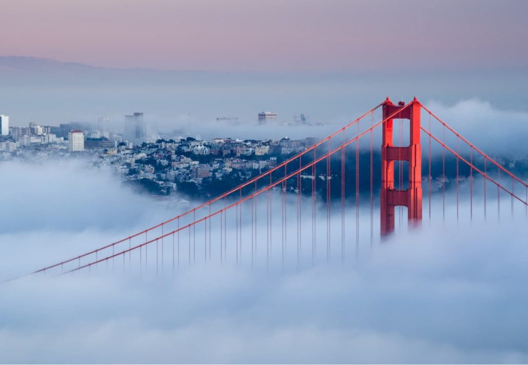 Golden Gate Bridge covered in fog, in San Francisco, California.