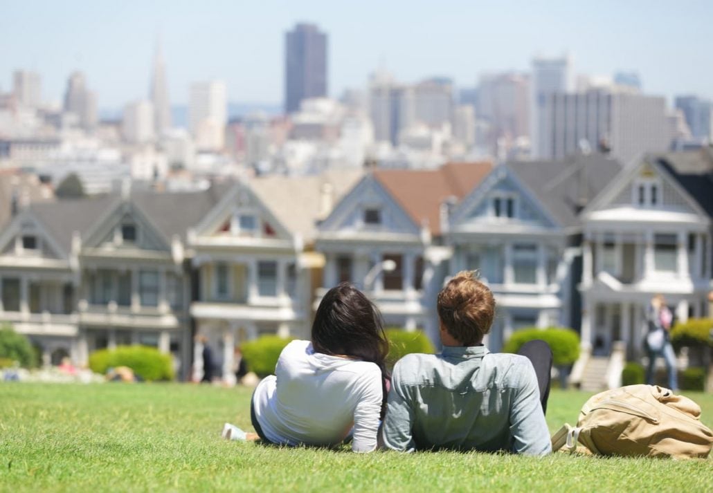 Couple overlooking the Painted Ladies, in San Francisco, California.