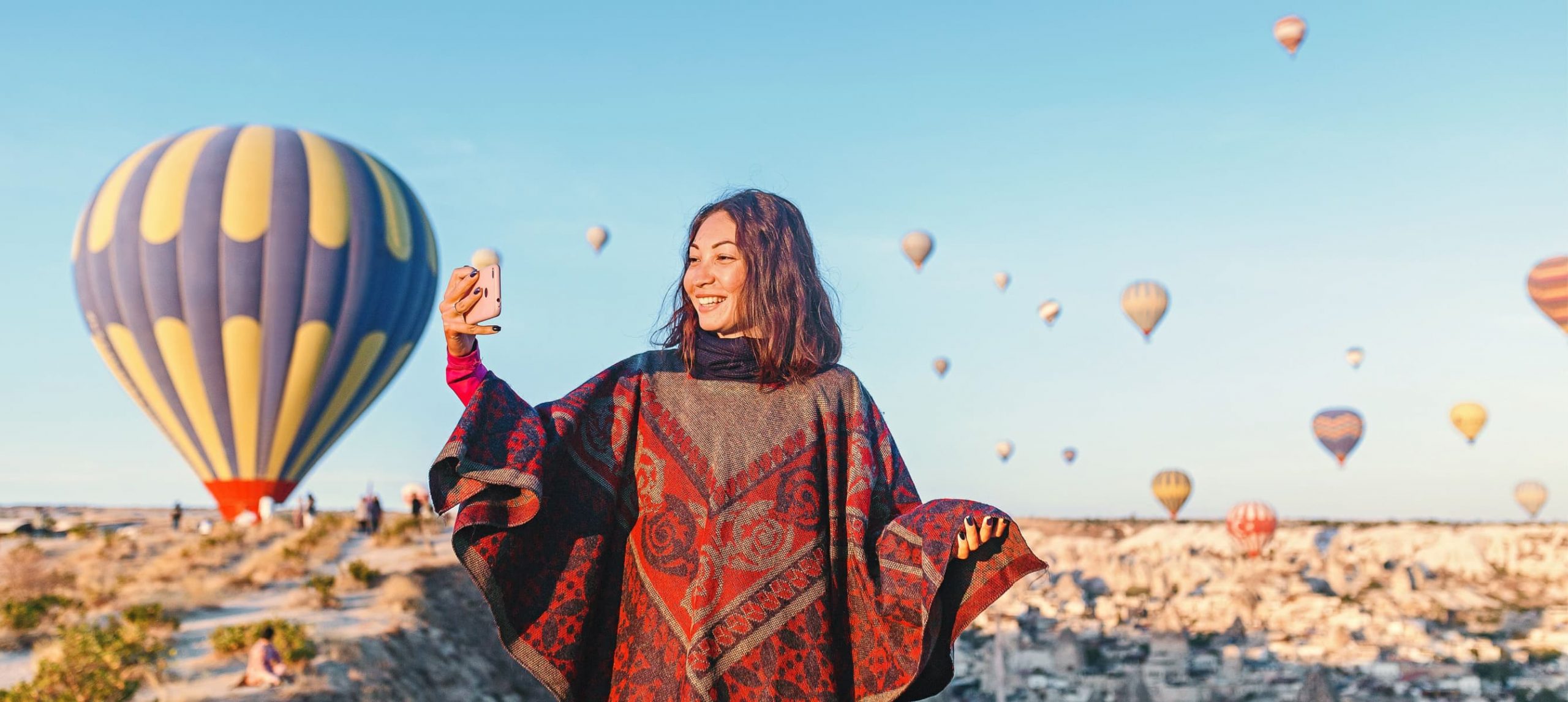 A woman taking a selfie in Cappadocia