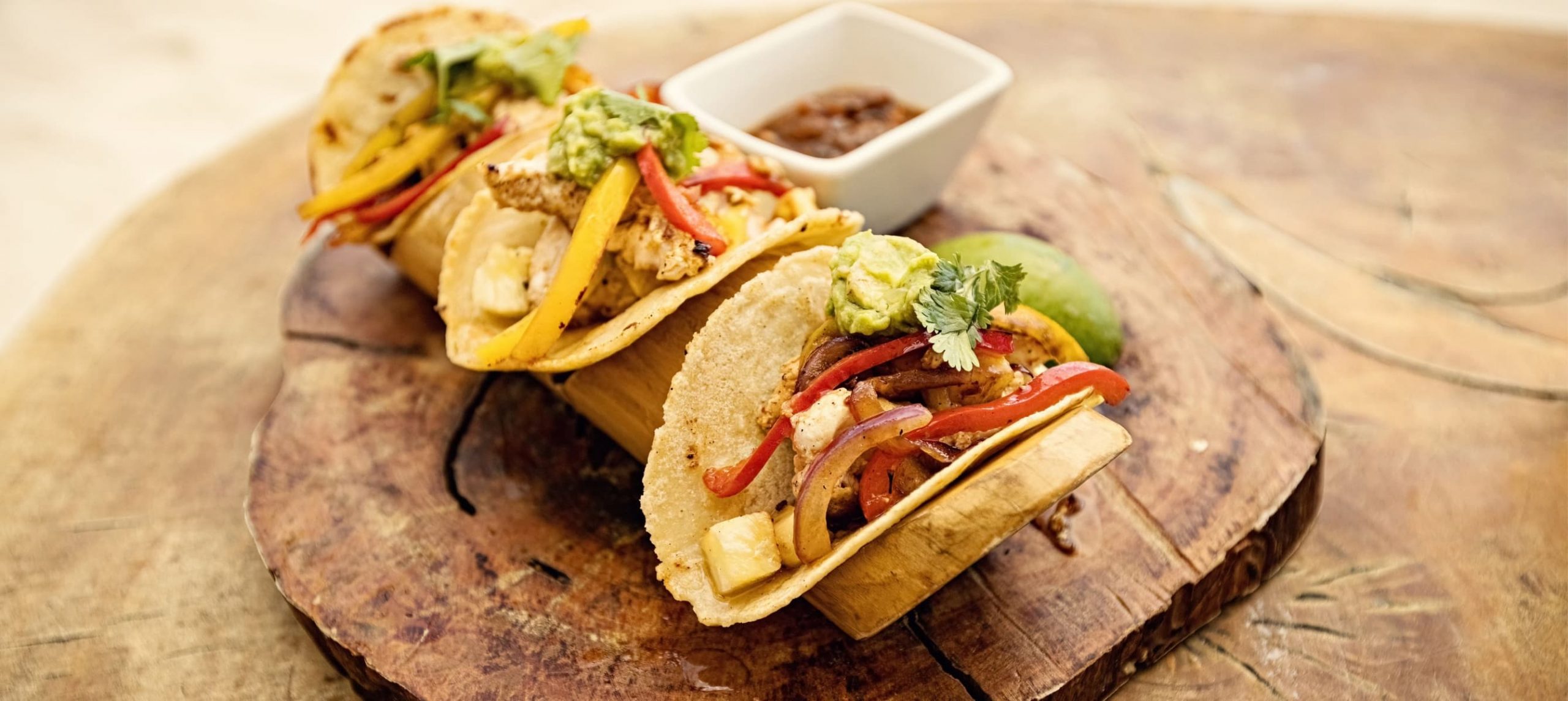 Tacos on a wooden plate
