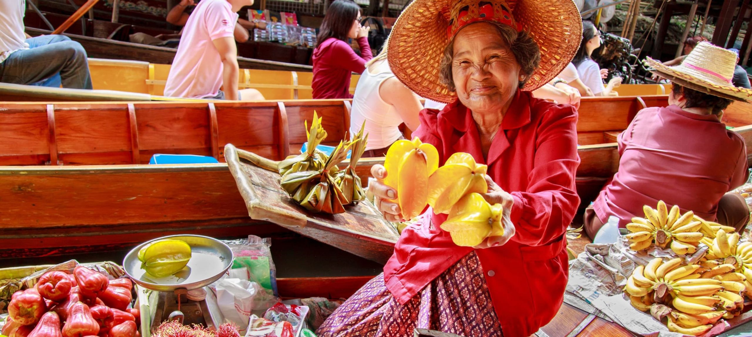 A lady selling fruit in Thailand