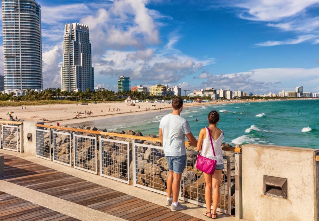 A couple on a promenade in South Beach, Miami, Florida.