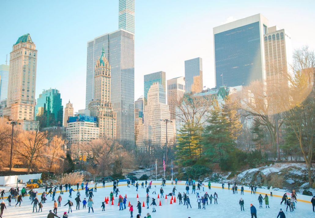 People ice skating in Central Park, NYC, during the winter.