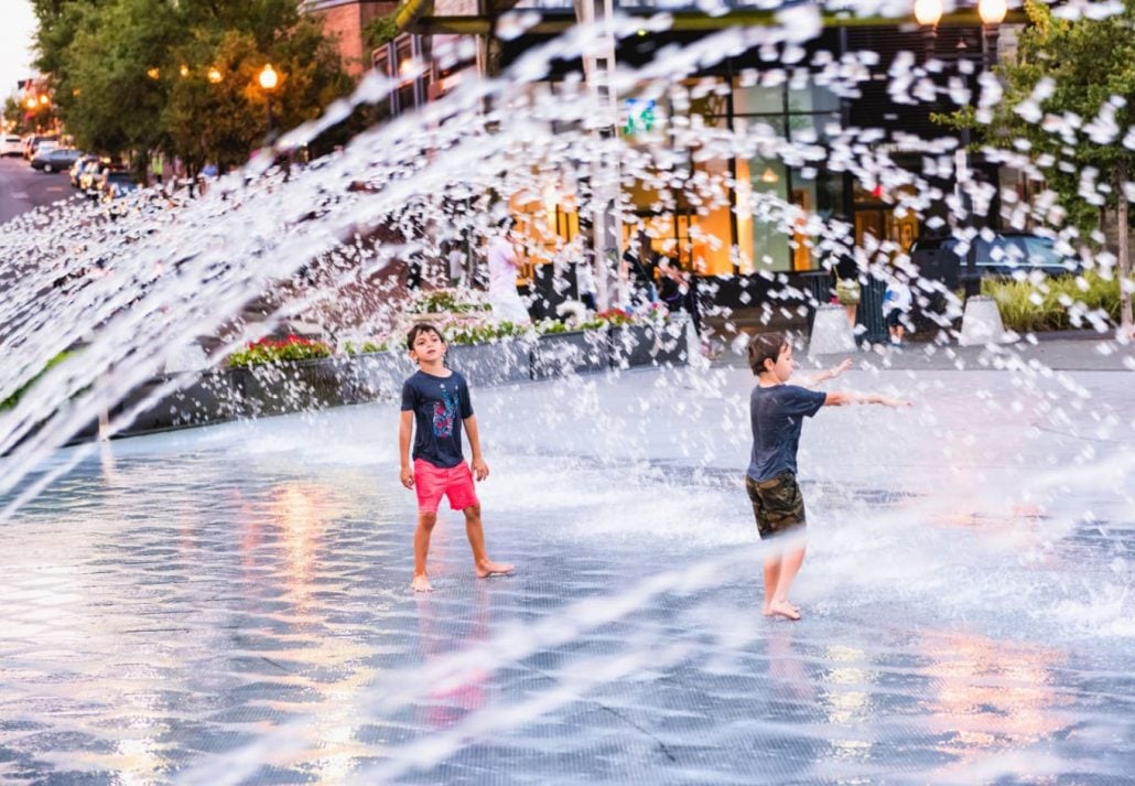 kids playing near the dancing fountains at Georgetown Waterfront Park