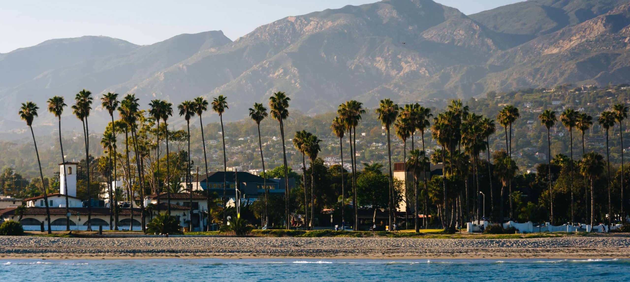 Santa Barbara framed by the mountains and palm trees.