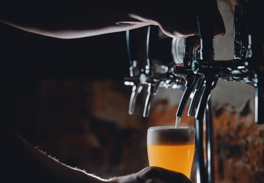 Beer on tap in a pub.