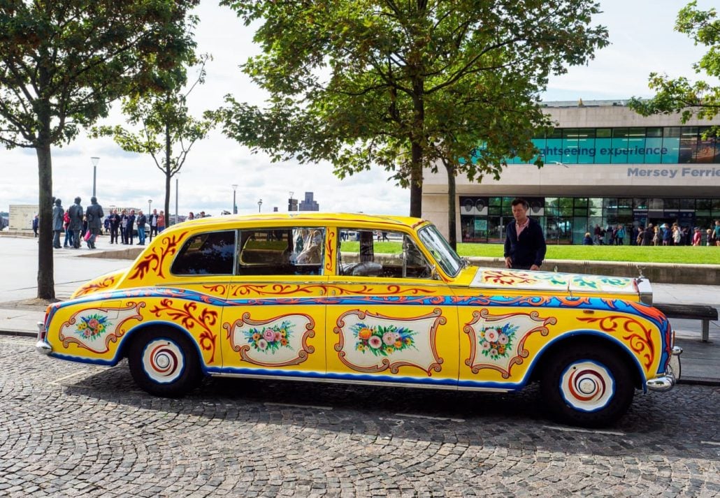 a colorful old-fashioned car in Liverpool