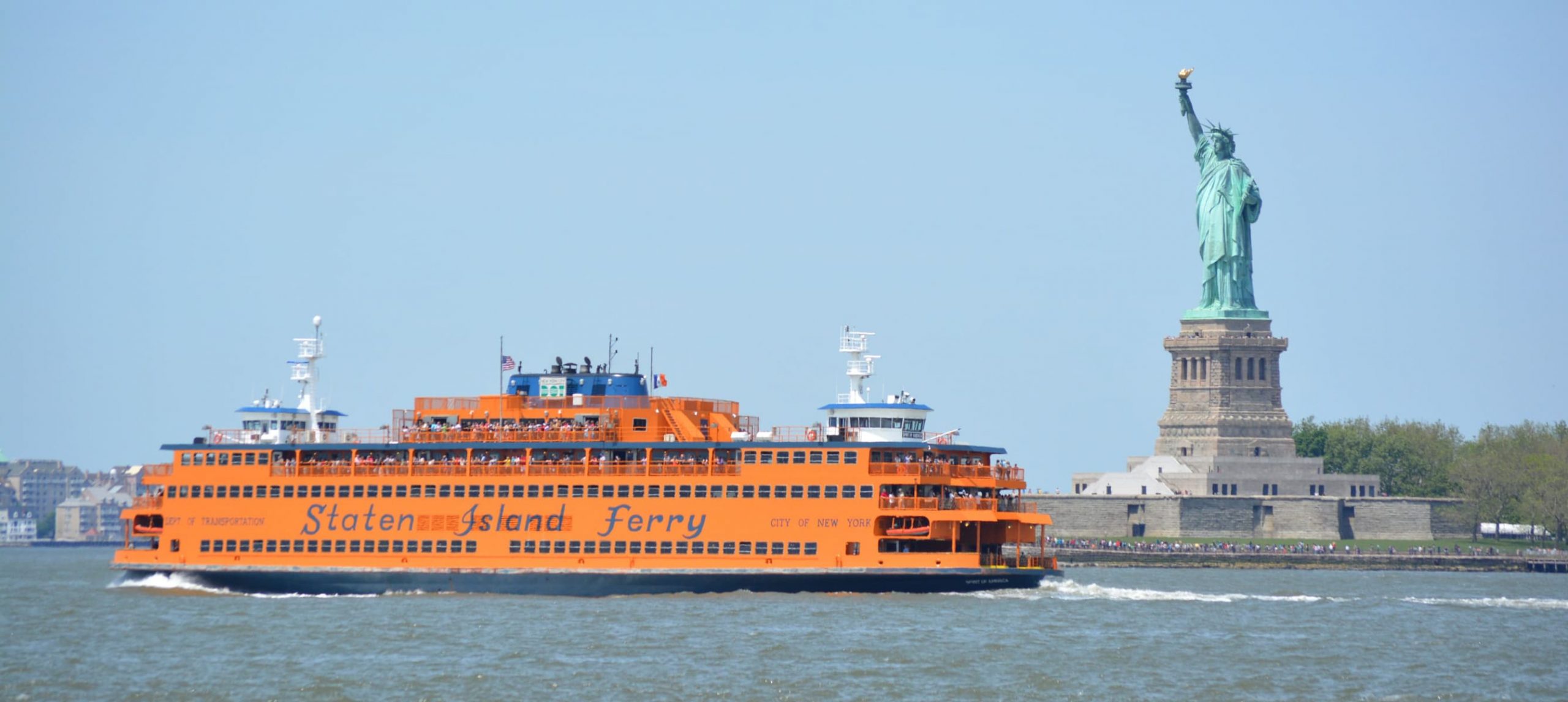 Staten Island Ferry passing by Lady Liberty