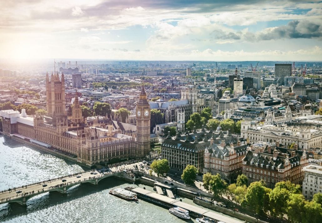 Aerial view of London with top landmarks like the River Thames, the Big Ben and the London Parliament Building.