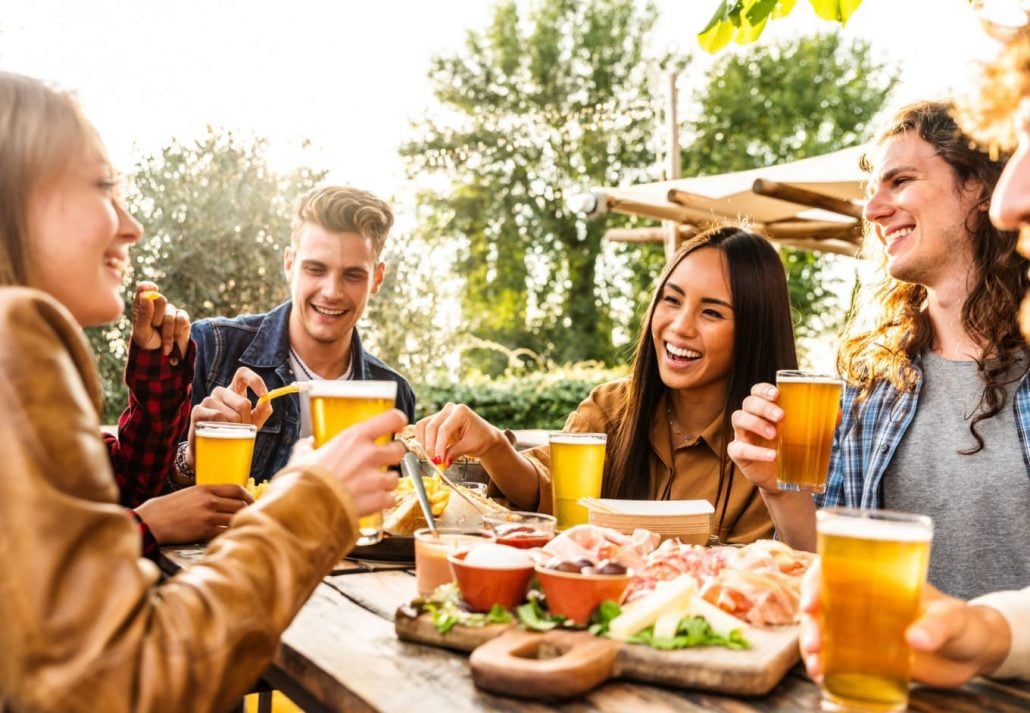 a group of friends having beer and snacks