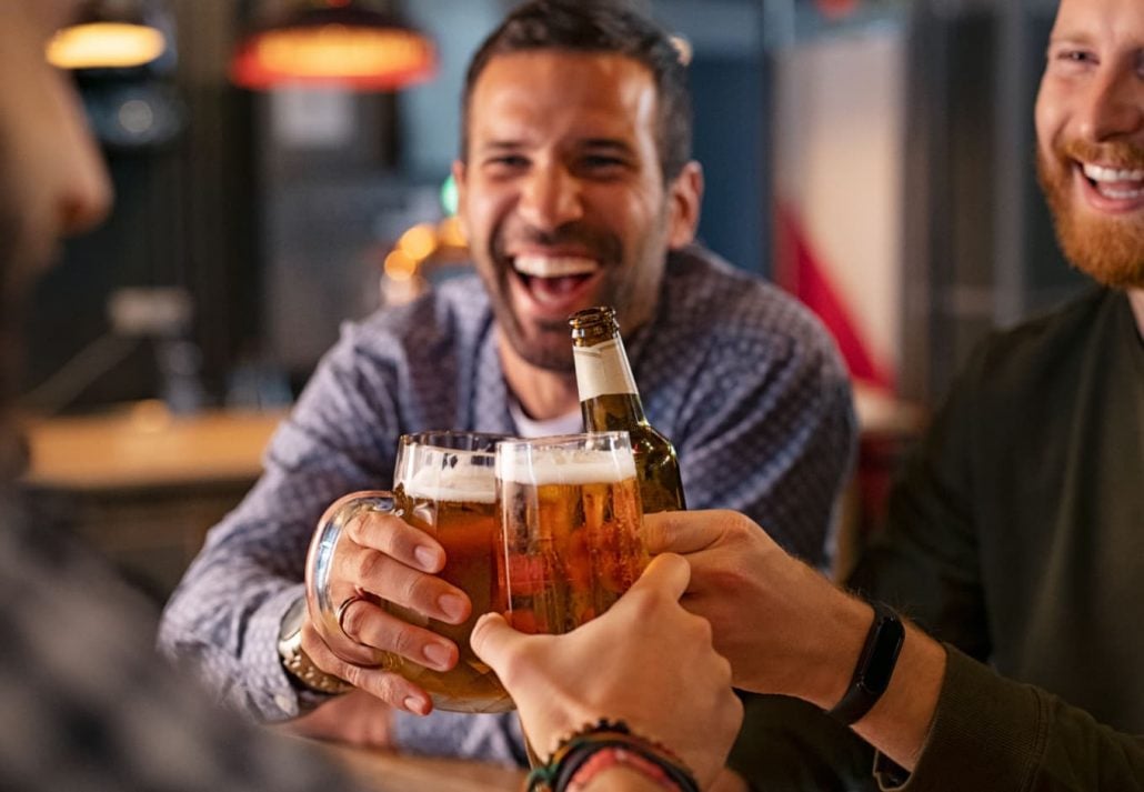 a group of men having beer