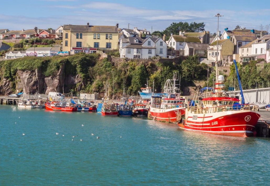 Colourful fishing boats in the harbour, Dunmore East, Waterford, Republic of Ireland, UK.