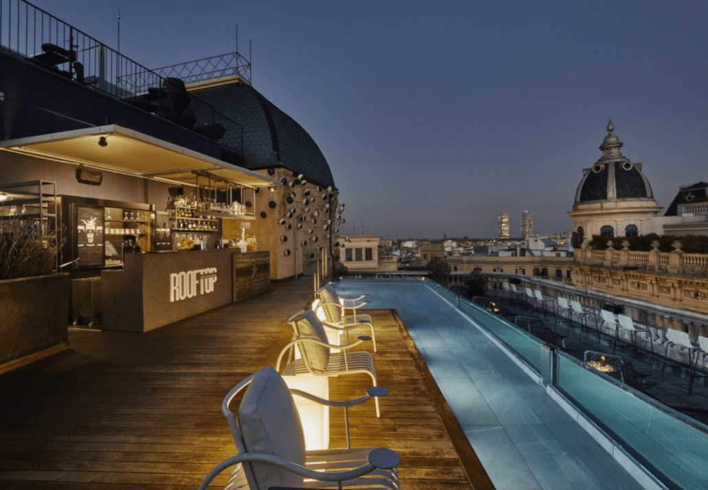 Rooftop pool of the Ohla Hotel Barcelona at nightime, in Barcelona, Spain.