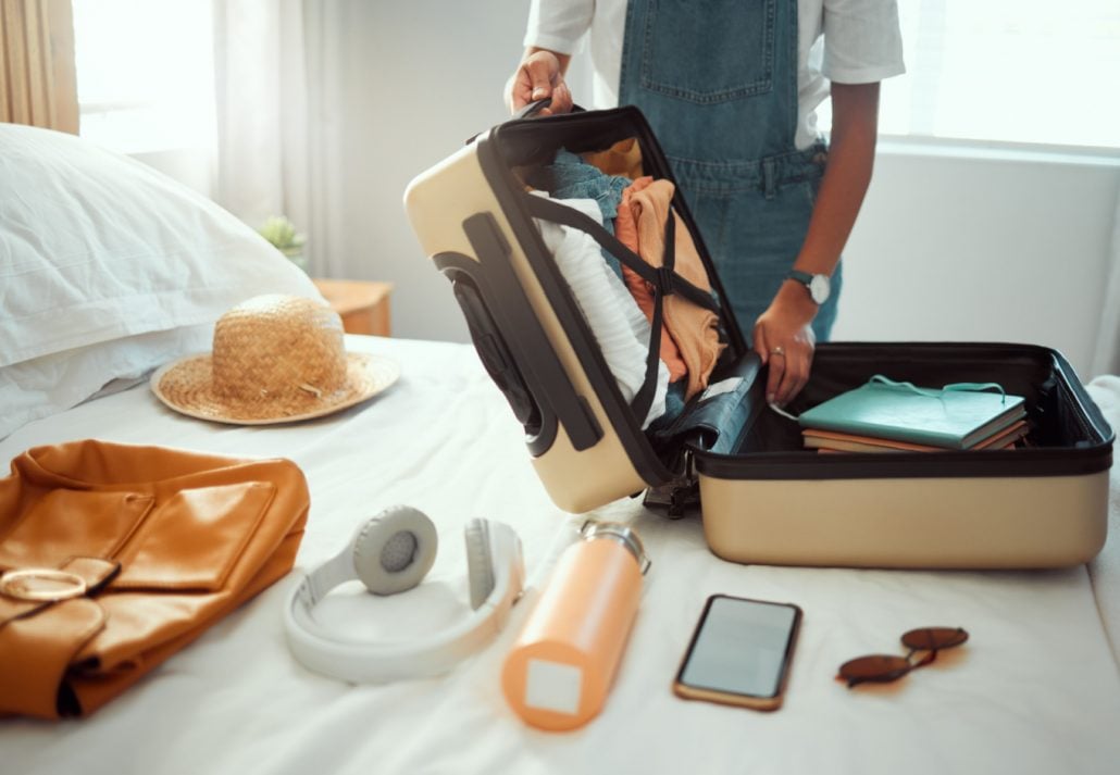 A woman packing her suitcase for her vacation.