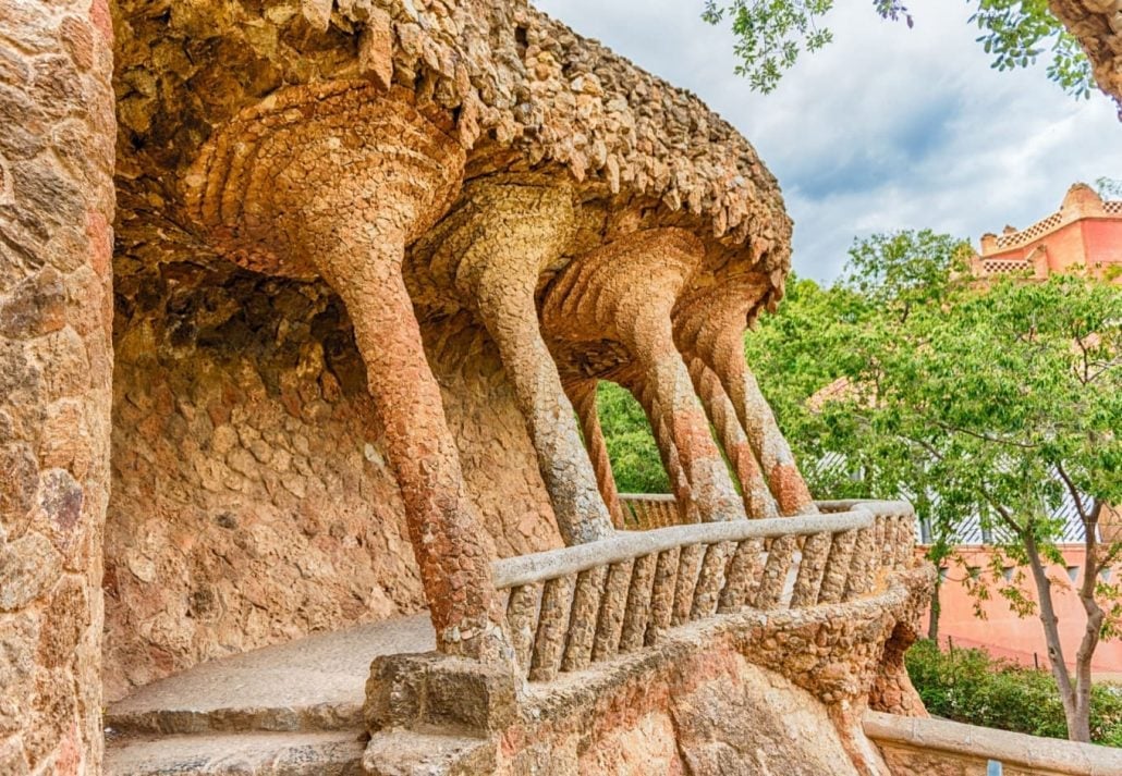  Colonnaded roadway viaduct made with masonry arcades in Park Guell, Barcelona.